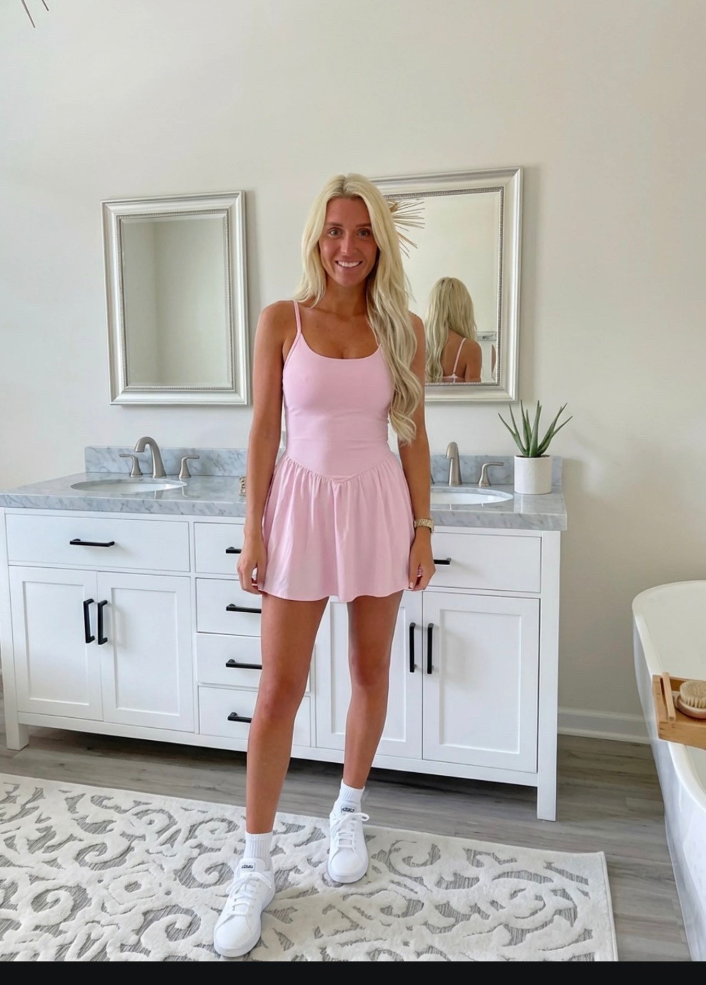 
Bright, lifestyle influencer selfie in a minimalist dressing room mirror. A stylish blonde woman with long beachy waves wears a green and white striped sleeveless polo dress paired with white Adidas sneakers and gold bracelets. The look is sporty-chic and effortless. Neutral dressing room background with soft lighting, clean wood floors, and a relaxed summer vibe. The aesthetic is preppy, travel-ready, and Instagram-worthy — Ralph Lauren meets casual golf resort style. The mood is confident, playful, and polished.

⸻

Caption

Sporty, comfy, and ready for wherever the day goes ✨
This is my favorite kind of outfit — easy, travel-ready, and cute enough for anything from running errands to grabbing lunch or hopping on a flight.

Athleisure but make it preppy chic 💚

— Heidi

⸻

Hashtags

#trendyheidi
#trendywithapassport
#sportychic
#athleisurestyle
#preppystyle
#summeroutfits
#everydaystyle
#adidasstyle
#casualchic
#airportoutfit
#weekendstyle
#tenniscore
#golfstyle
#traveloutfit
#effortlessstyle
#womenwithstyle
#styleinspo
#outfitinspo
#ootdfashion
#everydayfashion
#influencerstyle
#lookbookstyle
#amazonfashionfinds
#casualfashion
#fashionreels


#LTKdayinmylife #LTKSpringSale #LTKgrwm
