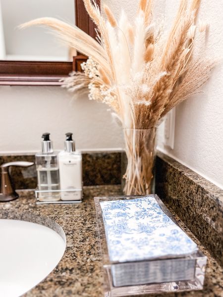 Half bath decor 🤍 If you are updating your bathroom decor for spring or Easter, these blue floral guest towel napkins are so good. I’ve also linked some others I have my eye on 👀 I also love this bundle of dried pampas and other dried stems for decor that goes from fall to winter to spring easily. This set came with 104 pieces so I have them scattered throughout my house and guest bathrooms in large vases or small Bud vases. They don’t shed at all and have lasted several years already 🤍 
.
.
Bunny tails, boho decor, dried bouquet, blue napkins, caspari, hand lotion, signature scent, diffuser, guest bathroom style, half bath style, spring decor, spring refresh

#LTKfindsunder50 #LTKfindsunder100 #LTKhome