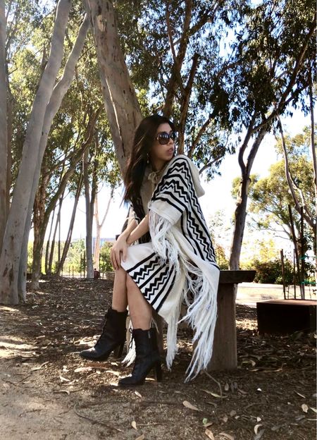 Keeping warm in my fringed poncho hoodie dress! I paired this with my lace up combat boots for a relaxed casual look! I love how you can layer up this dress or wear it alone! 

#LTKunder100 #LTKstyletip #LTKshoecrush