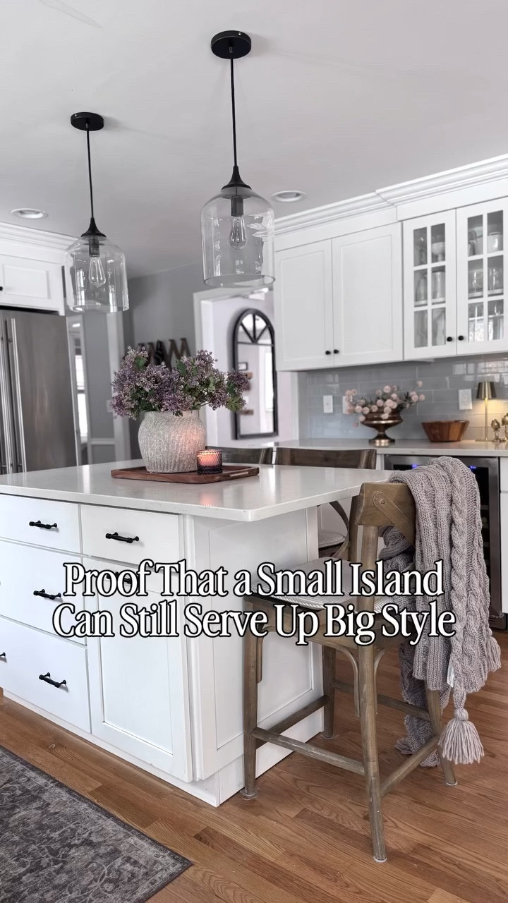 My island is a small but mighty workhorse. It’s only 3’x5’ but it works for us. With 2 kids in college and only 1 left home, it’s the perfect size for the 3 of to eat at. (when my older kids are home we eat at the table). On Friday nights, we roll out the dough for pizza nights on it. When we have a big crowd, we pull the stools out and use it as a big buffet station. With a little decor, a cozy throw, and my favorite (10 year old) wooden stools, it’s both pretty and functional. 

🛒🔗 For links to everything in my kitchen including my pendant lights, stools and all my decor, comment “SHOP” and I’ll send you a DM with the links to everything. 🔗🛒

#reels #kitchen #kitchendecor #kitchendesign #cozyhome