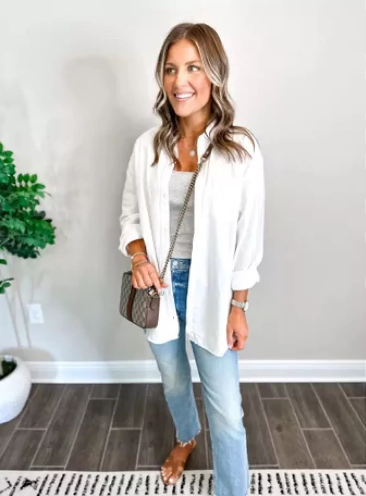 white bra top with white blazer and jeans