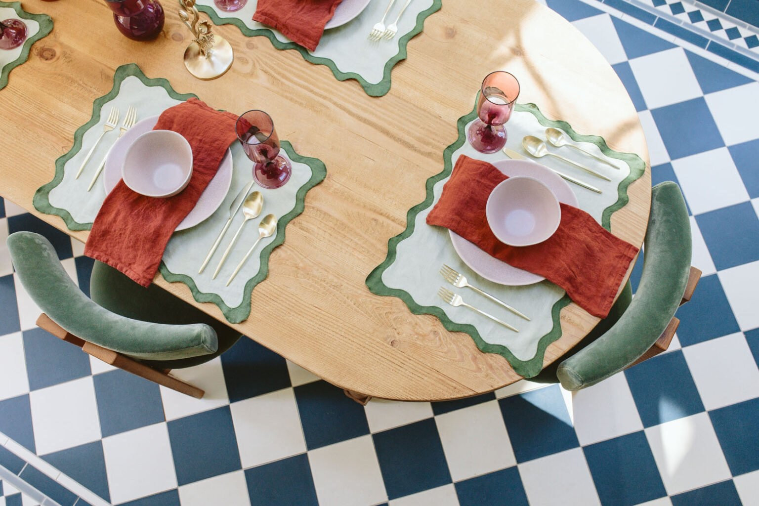 I curated a tablescape look based on products I truly loved and wanted for myself, and the color palette is both fall and holiday. So today is really just a show and tell, and hopefully some inspiration for any dinner parties you have coming up for any season, honestly. It all started with the blue floral platter and pitcher (and plates that were on back order but I REALLY want them), because my inner English grandma LOVES this color and floral motif so much. If I had registered for fancy china when we got married, these would have been them. Then my next love has to go to the scallop placemats (that also come as napkins and in other colorways). They literally couldn’t be more perfect with my green chairs. At first I was nervous about the color palette – the orange/red tone of the napkins, light mauve plates with the purple glasses, mossy green, bright blue, and amber – it just isn’t a palette I’ve played with before – but my goodness it turned out to be unexpectedly fun. It’s a lot going on, but somehow really works.

#LTKCyberWeek #LTKHoliday #LTKGiftGuide