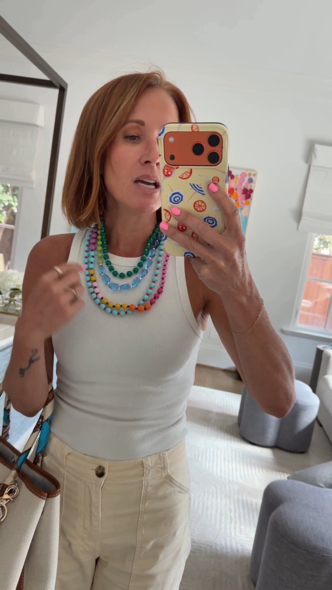 This Erin McDermott colorful layered beaded necklace stack is having a major moment on my neck and for good reason — four bold statement necklaces in green, teal, blue, pink, orange, and yellow resin beads that you can wear all together for a maximalist summer jewelry look or style individually with any outfit. It is currently 44% off at Nordstrom which is one of the best discounts this stack has ever seen, and at that price point it is genuinely one of the best summer jewelry deals at the Nordstrom Anniversary Sale worth grabbing before it sells out. A colorful beaded necklace stack like this is the easiest way to transform a simple white tank or neutral summer outfit into a complete and intentional look without any other accessories needed.

#LTKSaleAlert #LTKOver40