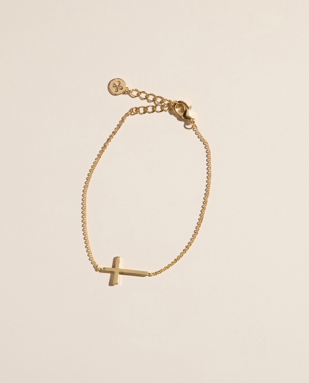 This sideways cross bracelet is waterproof and under $40. 