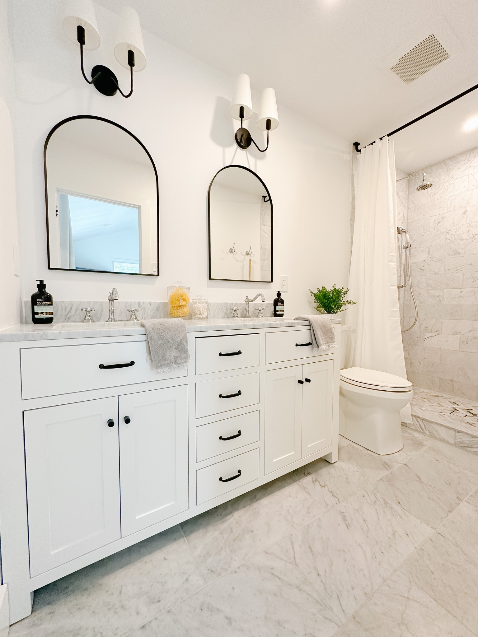 Organic Modern Primary Bath

Bathroom design, double vanity, arch mirror, black hardware, marble, marble tile, bathroom sconce, sink faucet, chrome sink faucet, mixed metals, faux fern 

#LTKsalealert #LTKhome #LTKunder100