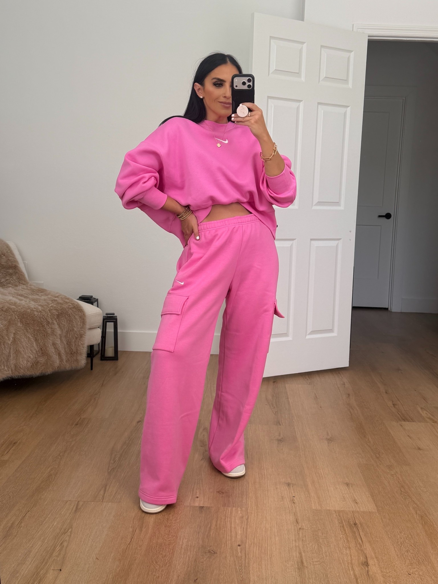 Woman’s Nike Sportswear Phoenix Fleece Over-Oversized Crew-Neck Sweatshirt. I’m wearing a size small.

Woman’s Nike Sportswear Phoenix Fleece cargo pants. I’m wearing a size medium. 