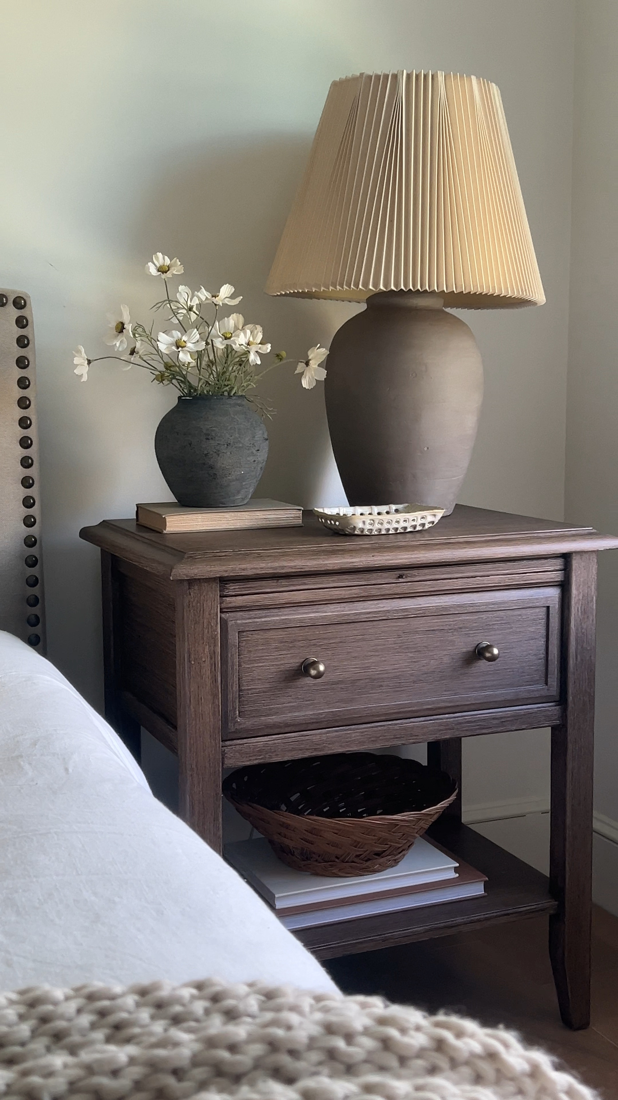 Nightstand Styling Inspo | pottery barn inspired | wood nightstand | vase | cosmo stems | antique brass knobs | lamp | blanket | bedroom decor | duvet cover 

#LTKhome #LTKfindsunder100 #LTKfindsunder50