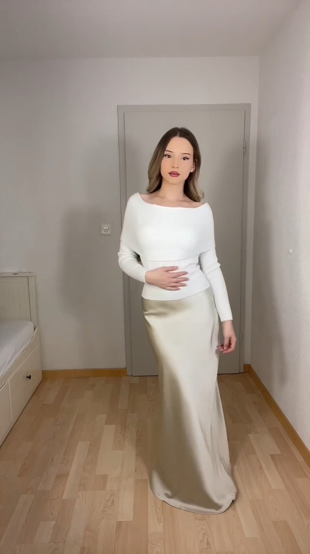Modest and elegant outfit inspiration featuring timeless pieces:
	1.	A white fitted knit top paired with a champagne satin maxi skirt for a soft and polished look.
	2.	A flowy white maxi skirt styled with a black fitted cardigan, creating a sophisticated and feminine contrast.
	3.	The same white maxi skirt styled with a black cardigan and black structured bag, perfect for a graceful and modest vibe.
	4.	A white tee tucked into a black belted maxi skirt paired with classic black heels for an effortlessly elegant monochrome outfit.

#ModestFashion #ElegantStyle #TimelessLooks #MinimalOutfits #FeminineFashion #ClassyStyle #MonochromeOutfit #ModestInspo #ChicStyle #LTKStylist #LTKModest #LTKElegant #LTKClassic