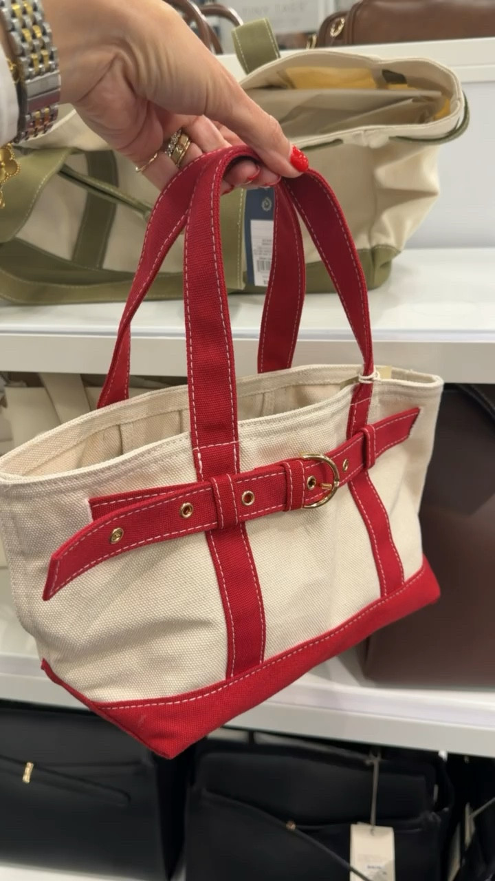 This little tote is such a good find ❤️ The red detail makes it pop while still feeling classic and wearable. It’s the perfect everyday bag for summer and so cute with denim or a simple dress

summer bag, tote bag, everyday style, classic accessories, casual chic, vacation outfits, themominstyle 

#LTKootd #LTKOver40 #LTKSeasonal