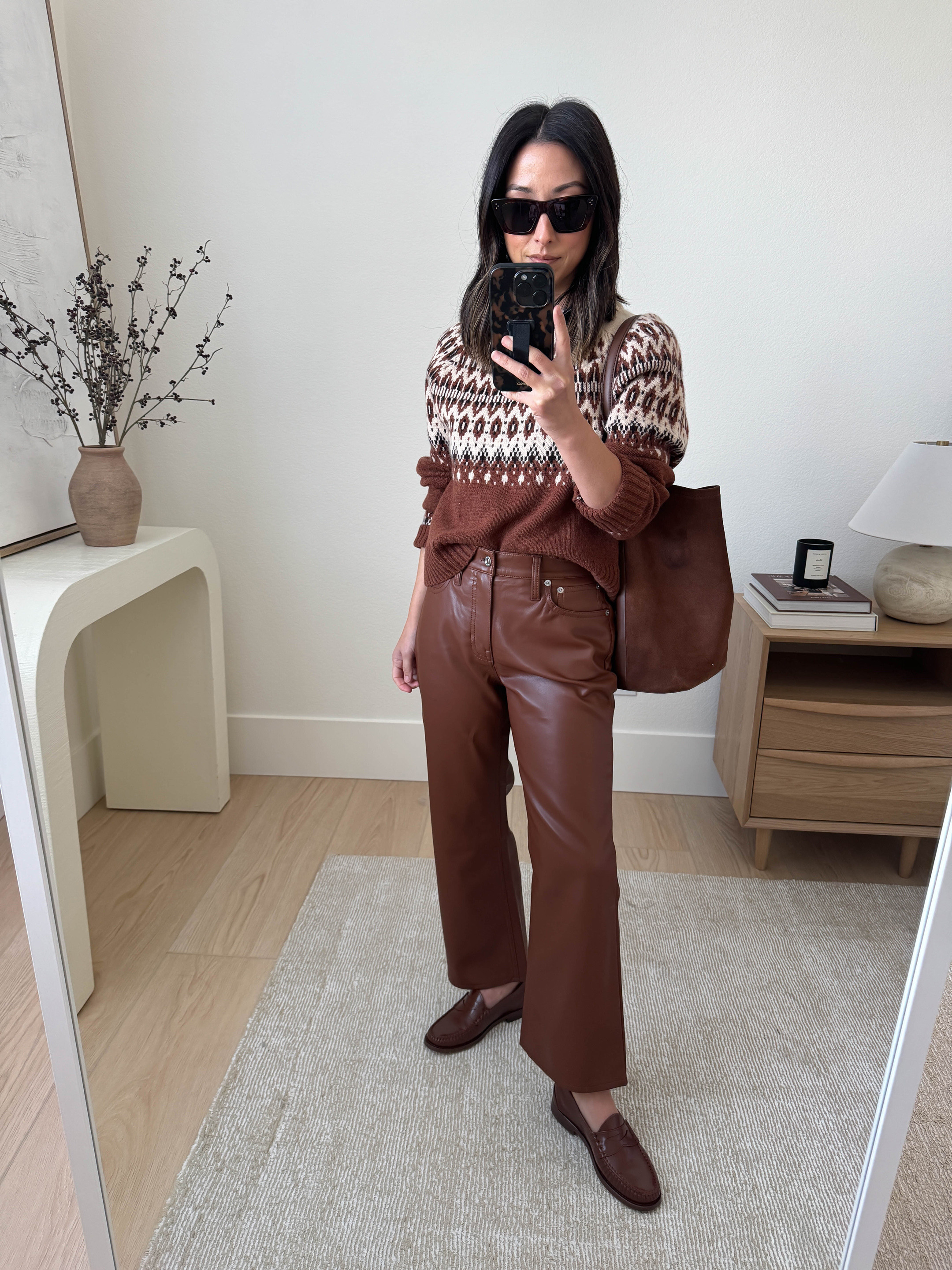 Love a good fair isle this time of year! Size up in this one for more room. These are also my favorite faux leather pants. I size up, but you don't have to. Petite length actually fits!

J.Crew Sweater xs
J.Crew pants petite 25
J.Crew loafers 5
J.Crew bucket bag
Celine sunglasses

#LTKSeasonal #LTKHoliday