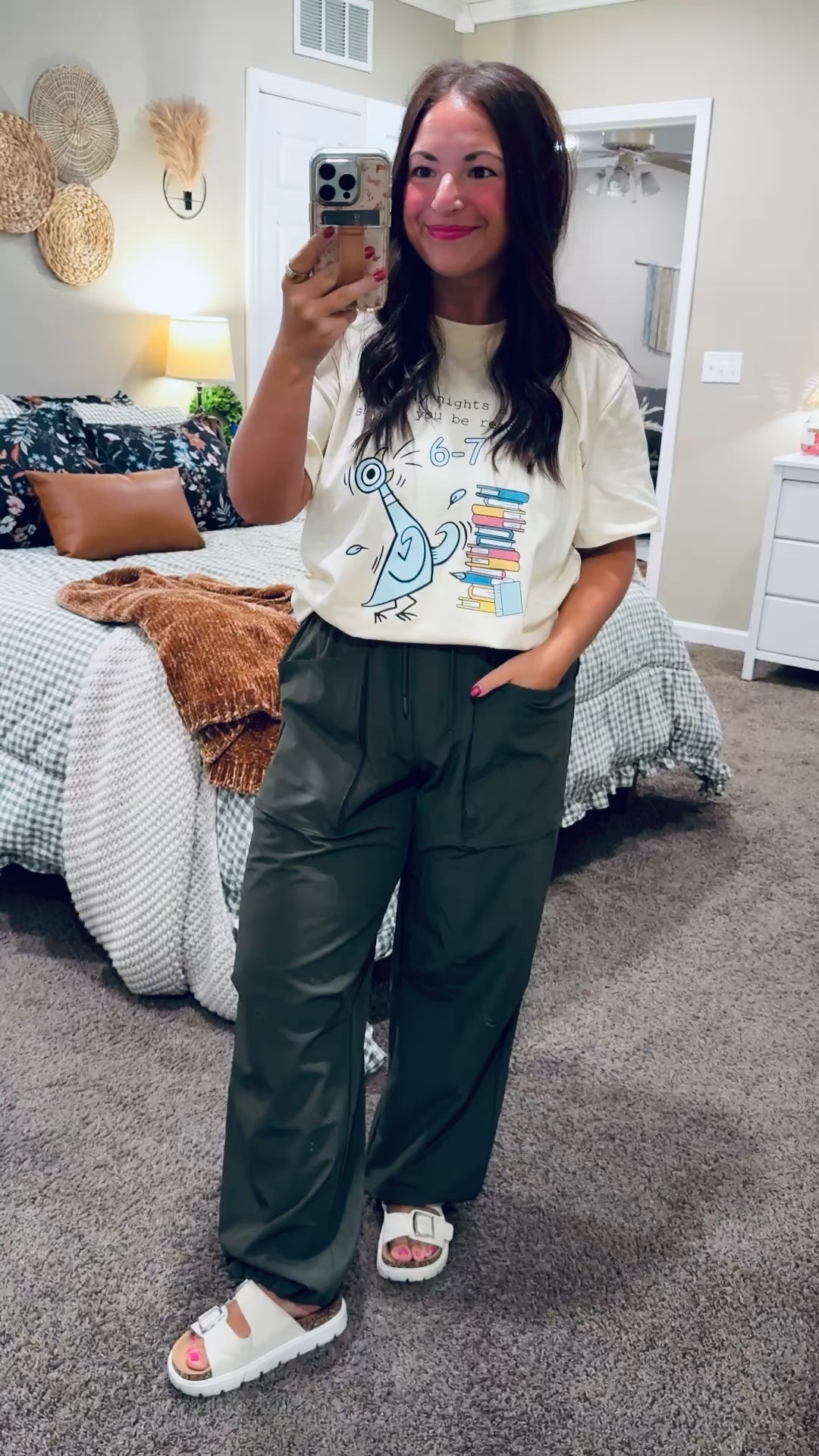 How many nights a week should you be reading? 6–7! 📚💚 Such a fun tee to encourage students to grab a book—with a little middle school humor! Paired with comfy olive pants for a casual classroom look.

sandals: sold out, but linking similar options below!
pants: fit true to size // wearing a medium
tee: fits true to size // wearing a large 

 #LTKootd #LTKMidsize #LTKWorkwear