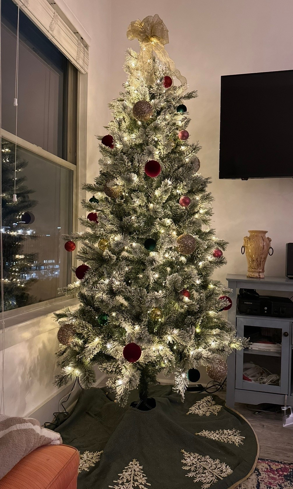Found the best tree at Michael's!! Can be found online and at Costco. It was on major sale for cyber Monday!! The lights twinkle and can change to multi color. Tree skirt is from HomeGoods! Love these target ornaments & ornaments from Michael's! Perfect for an apartment. 

#LTKSaleAlert #LTKHoliday #LTKCyberWeek
