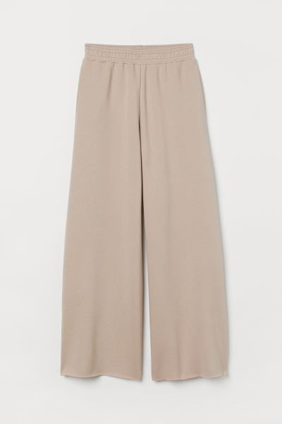 Sweatpant joggers in a cotton and recycled polyester blend. High waist, waistband with covered el... | H&M (US + CA)