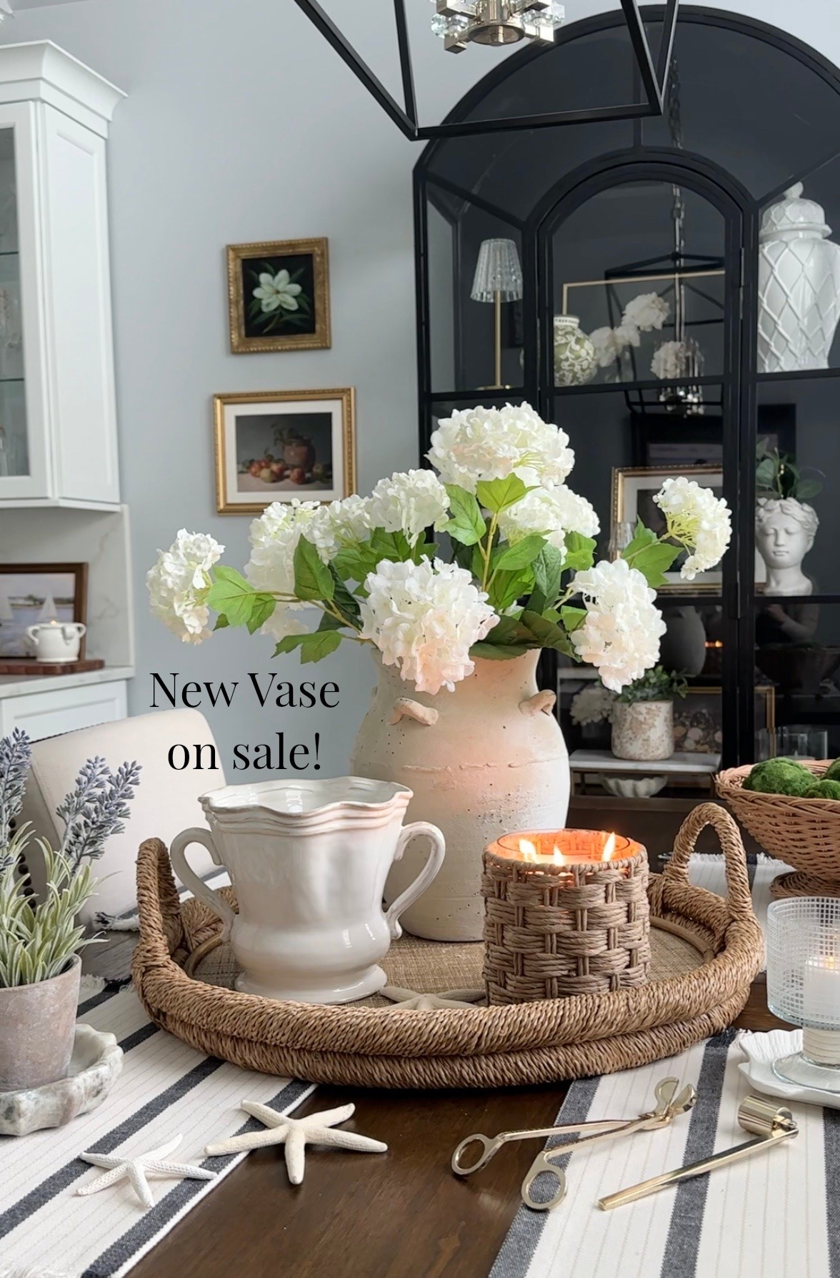 Beautiful new double handle vase on sale! Shop textured neutral vase, rattan candle is an amazing fragrance, lavender arrangement, votive candle on sale, hydrangeas, rattan bowl, artwork, display cabinet, and more spring to summer home decor accessories.

#LTKdayinmylife #LTKHome #LTKSaleAlert