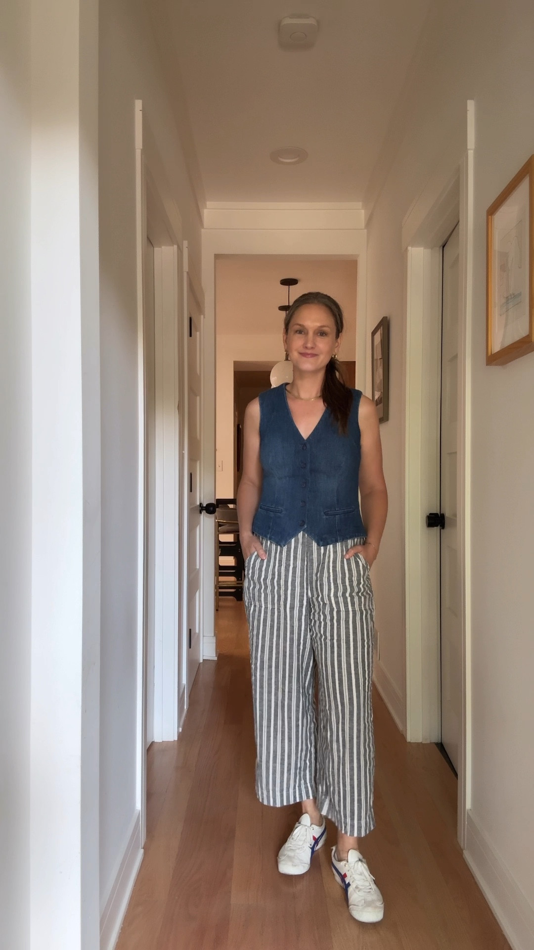 Tuesday in Chicago, our cool city mom steps into navy-and-white striped linen pants and a trusty denim vest, her favorite sneakers ready for anything, gold hoops swinging gently, her herringbone necklace catching the light, and her single remaining permanent bracelet clinking softly as she navigates the day. The morning started with pure joy, trains chugging and guitar riffs echoing as her son jammed away before daycare drop-off, but the energy shifted quickly as she rushed home to take her dog to the vet after a sudden decline in health. Wiping away tears, she tried to dive into work, only to be repeatedly derailed by phone updates from the vet, while the flood of photos and videos of her son laughing in music class highlighted the stark contrast between their moods. She does her best to stay positive, to find her footing amidst the worry, but sometimes life just insists on testing the heart, and even a cool city mom can feel the weight of it all.

#LTKWorkwear #LTKFamily #LTKStyleTip