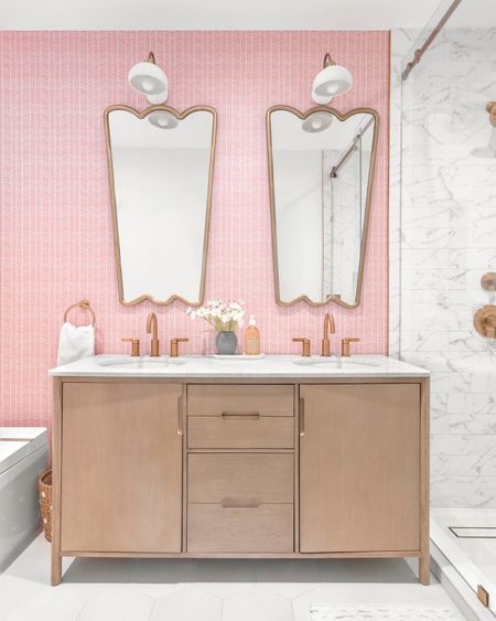This partial gut renovation was tailored for a dynamic family of four. Each space was meticulously crafted to reflect the eclectic taste of its owners. Explore the unique features that define this home's vibrant personality.

Beyond being a place to get clean, this kid's bathroom transforms into a whimsical space with chevron-patterned wallpaper and chic mirrors carrying through the design elements in the house and allowing bath time to become an adventure, infusing a bit of whimsy into the daily routine for the kids.

#LTKhome