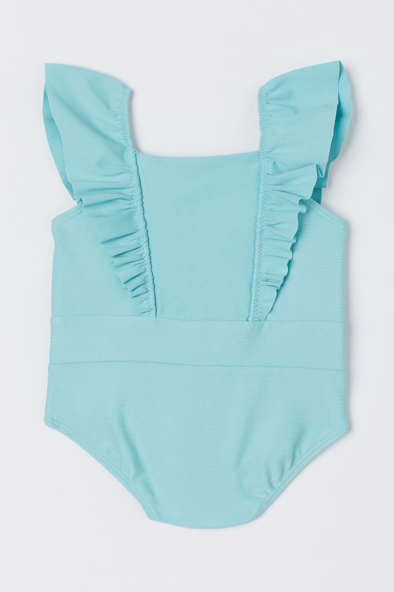 Fully lined swimsuit with ruffles at top extending over shoulders straps to back. Inset panel at ... | H&M (US + CA)