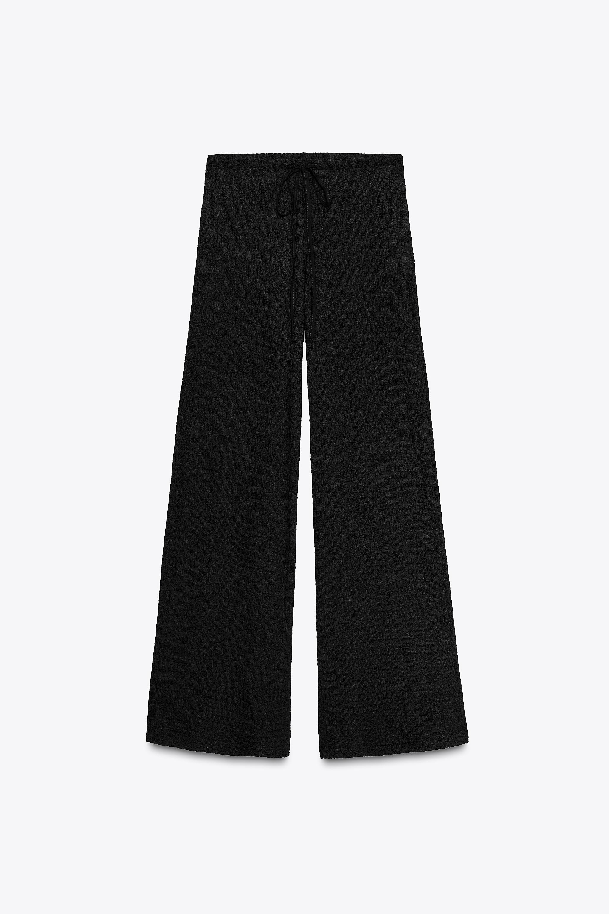 Pants made of structured fabric. High waist with adjustable elastic drawstring waistband. | Zara US