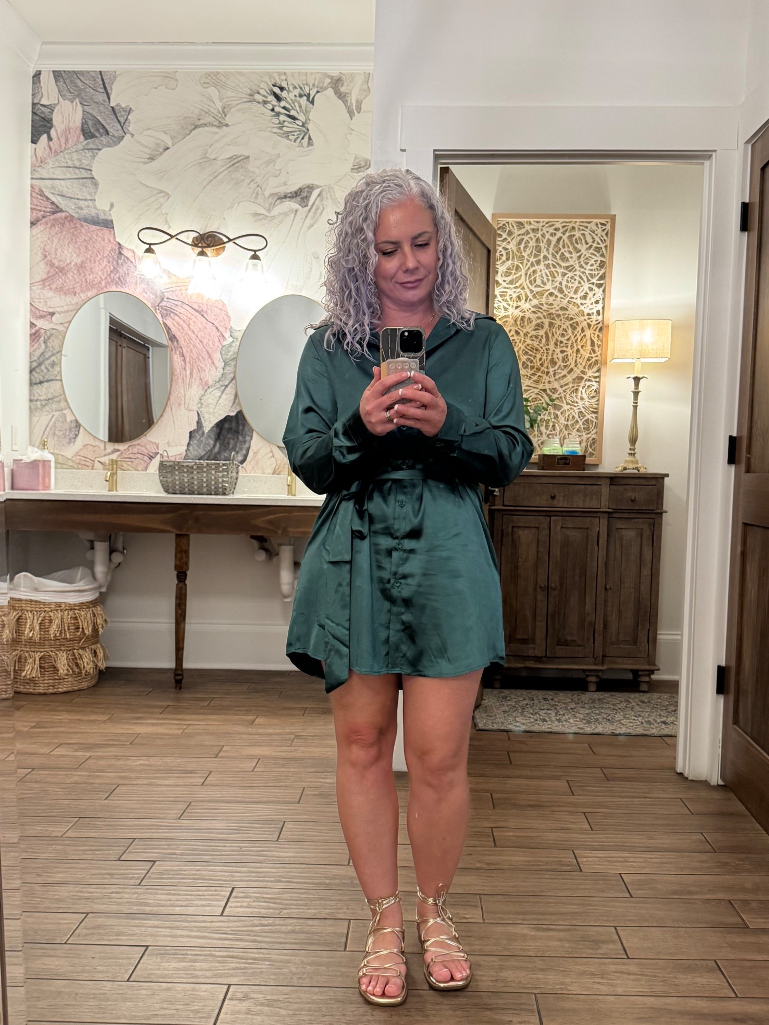 Effortless elegance ✨ Styling this stunning green silky dress with gold gladiator sandals and a chic gold lariat necklace for the perfect luxe look. Shop the look on LTK! #LTKStyle #EffortlessGlam #GoldenHourGlow