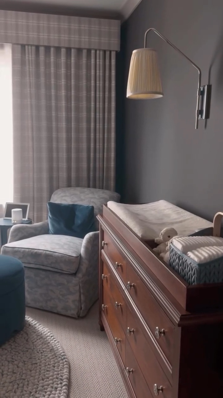 Asher’s nursery is almost ready! We’re missing a few details, but it looked so serene in nothing but natural light we wanted to share. The walls are painted Sherwin Williams Urbane Bronze. Such a dark hue might not immediately come to mind for a baby’s room but I think dark bedrooms feel comforting, like the walls are hugging you. Saturated, rich paint creates a calming backdrop and the contrast makes the soft colors and textures we used elsewhere seem even softer. Our favorite thing is definitely the handmade rug crafted with felted wool spheres! All nursery details and sources below…

Artwork @graymalin 
Rug @rosemaryhallgarten 
Fabrics @hollandandsherryinteriors @hollandandsherry_dallas 
Paint @sherwinwilliams 
Crib @serenaandlily 
Chair @highlandhousefurniture @hickorychairtx 
Dresser @potterybarn @chrislovesjulia 
Hardware @modernmatterhardware @markdsikes_interiors 
Windows @theshadestore 
Side Table @ochreochregallery 
Sconce @urbanelectricco 
Shelves @1stdibs 

#BabyBoyNursery #UrbaneBronze #CalmingSpaces #NurseryDesign #BabyRoomDecor #BoyNursery #NurseryDecor #BlueNursery #DarkNursery #PaintColors #NurseryPaint #BedroomPaint #Calm