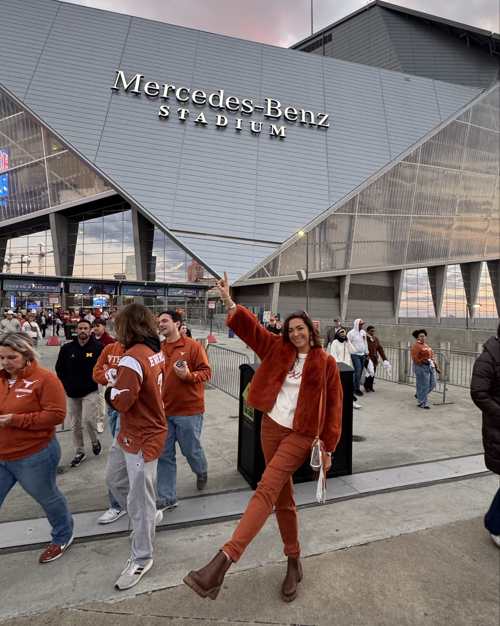 Peach Bowl Fit: old faux fur burnt orange jacket from @velvettees , $140 @stewartsimmons sweater, $60 @judybluejeans , $20 @Amazon shoes, $190 @leighannbarnes_official bag, $535 @ethicarat_jewelry ring, @sammoontrading earrings  & $45 @gamedayluxe bracelet!  

Items not on LTK:
Sweater: https://collabs.shop/kqmfjy

Bracelet: https://collabs.shop/9dkzvv

Jeans: https://freckledpoppy.com/products/judy-blue-high-rise-auburn-orange-double-cuff-jogger?srsltid=AfmBOopGazpH9ooR9shizdWZQKtTlAeUGnbhwROsGh82fWKLBpMf_XZB

Ring: https://www.ethicarat.com/store/p/initials-ring (use discount code BOB10)
