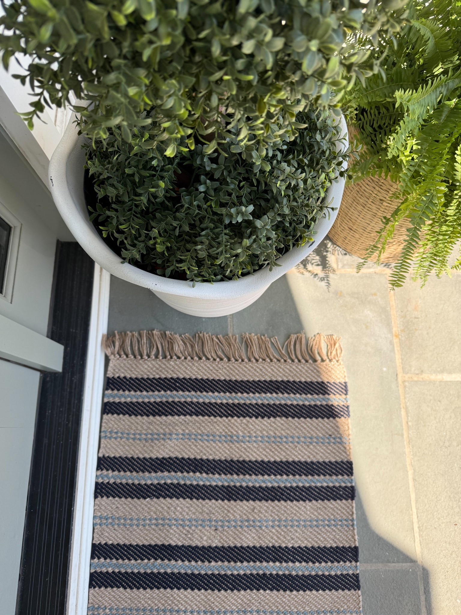 This striped outdoor rug is such an easy way to ground a front entry while adding just the right amount of pattern. The neutral tones keep it versatile, while the subtle contrast brings in texture without competing with the greenery and planters nearby. It’s one of those simple pieces that makes everything feel a little more finished and intentional.

striped outdoor rug, front door rug ideas, entryway outdoor decor, neutral outdoor styling, front porch rug inspiration, layered outdoor decor, curb appeal ideas, outdoor entry styling, classic front porch decor, neutral exterior design, welcoming front entry girlonthehudson

#LTKHome #LTKSeasonal