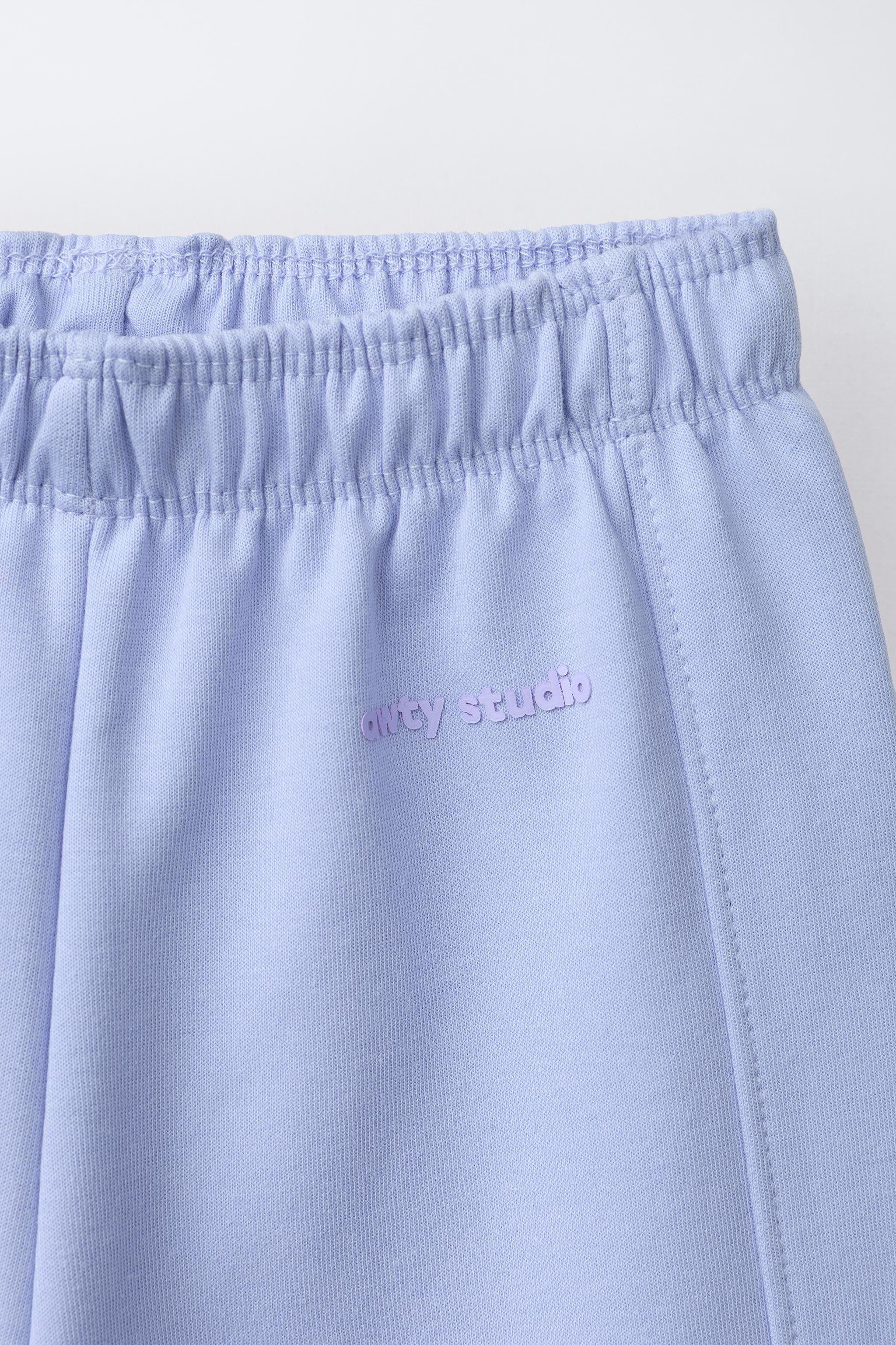 WIDE LEG INTERLOCK RAISED TEXT PANTS | Zara US