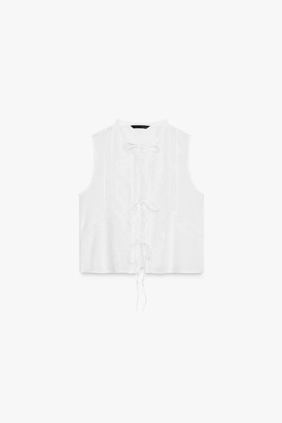 Sleeveless round neck top. Tonal embroidered detail. Front tie closure with slits. | Zara US