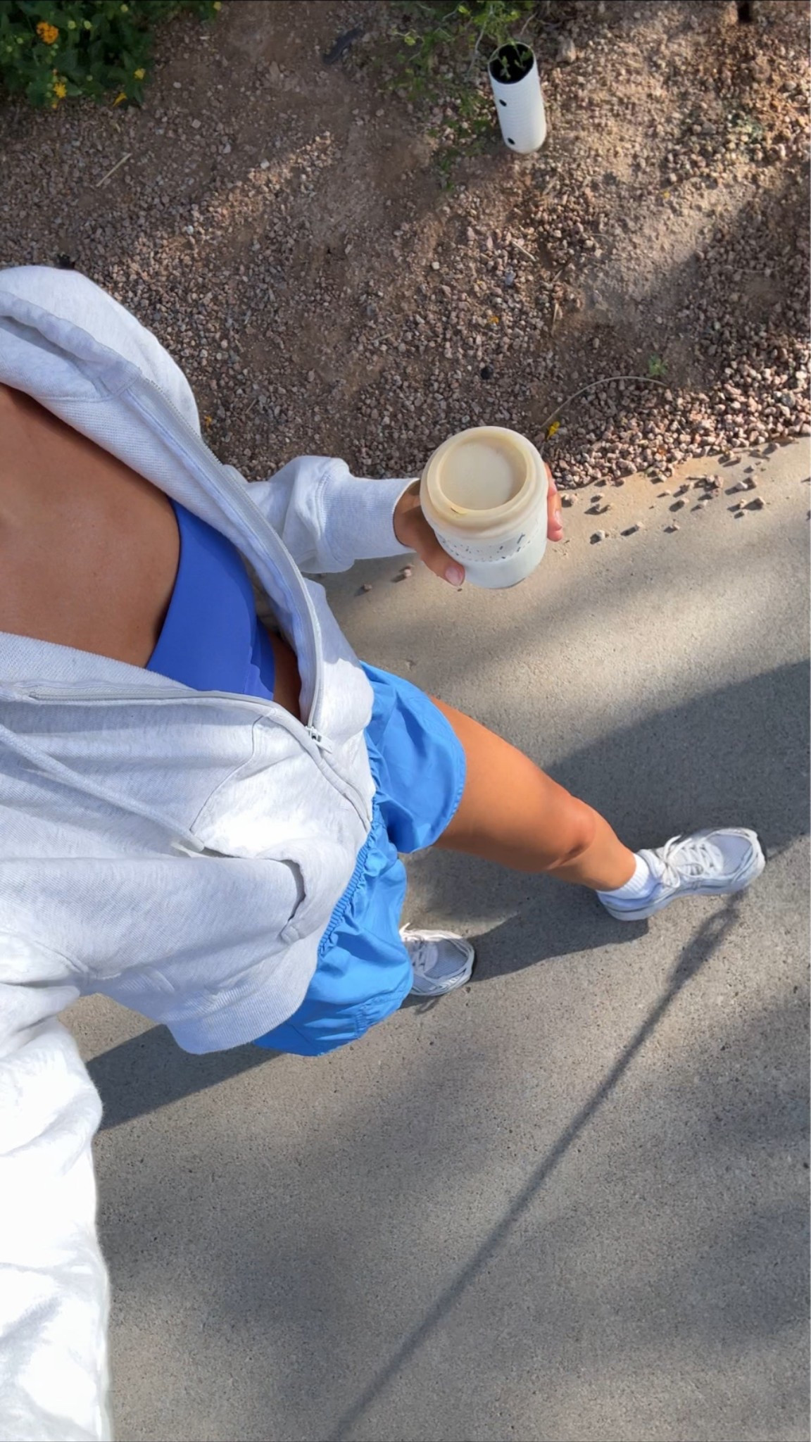 I’m 5’7” wearing a XS in the shorts and sports bra and small in the zip jacket!