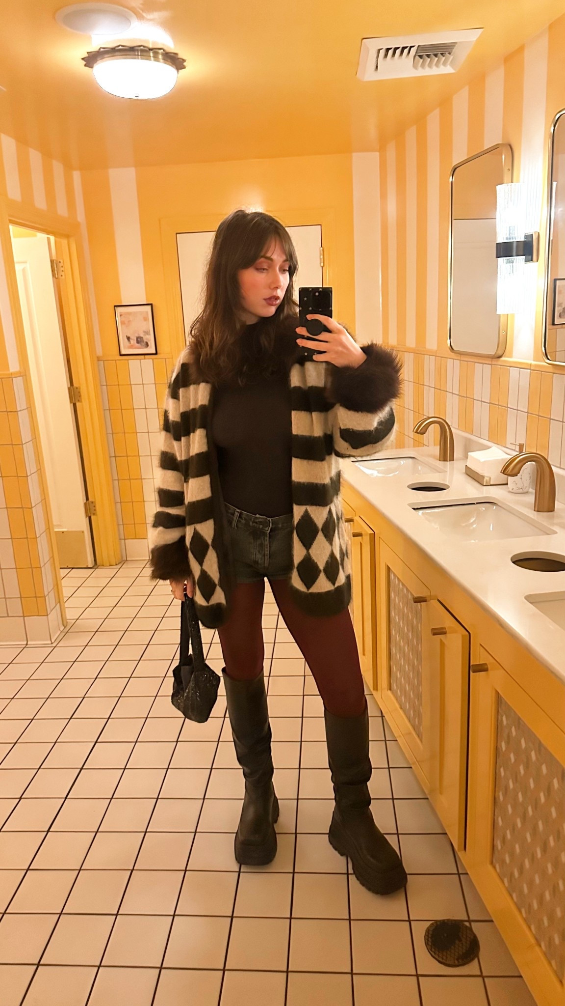 Colored and printed tights are always perfect for fall and winter and I’m obsessed with how these maroon tights add instant personality to an outfit. I paired them with a classic black Skims turtleneck, mini shorts from One Teaspoon, tall boots from Naked Wolfe, and the most insane vintage angora + fur Cache sweater I thrifted at Goodwill (!!).

It’s the perfect mix of cozy textures, rich winter colors, and a fun pop on the legs — so good for fall/winter outfits, holiday dinners, or a night out. How cute is this bathroom at Chez Mia in weho?

#ColoredTights #PrintedTights #WinterOutfitInspo #StatementTights #MaroonTights #FallStyle #NakedWolfeBoots #SkimsTurtleneck #OneTeaspoonShorts #VintageKnitwear #ThriftedFashion #CozyLayers #TexturedOutfits #HolidayOutfitIdeas #LTKStyle #LTKWinterFashion

#LTKHoliday #LTKSeasonal #LTKStyleTip