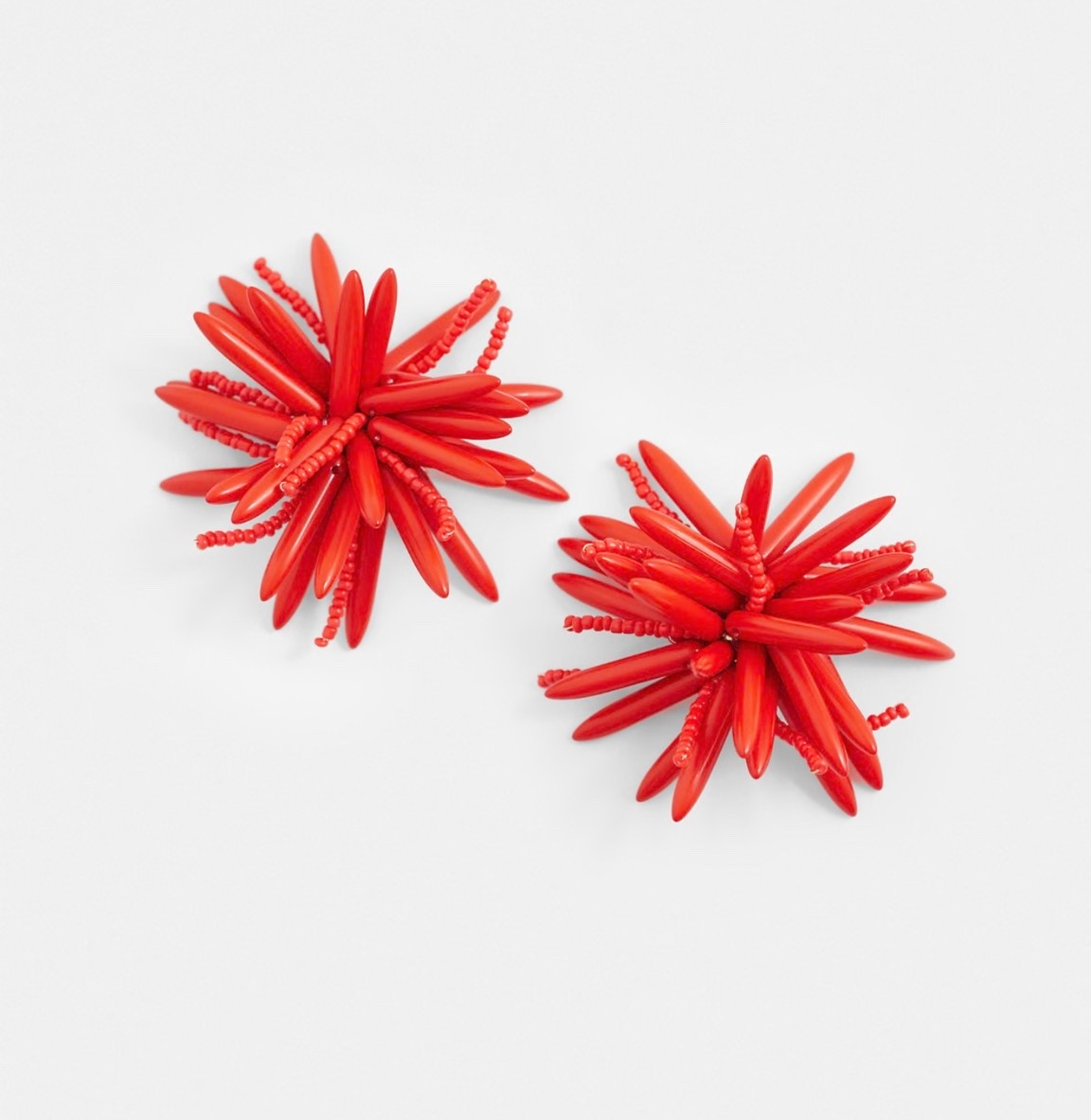 Red statement earrings! 

#LTKgrwm #LTKMidsize #LTKootd
