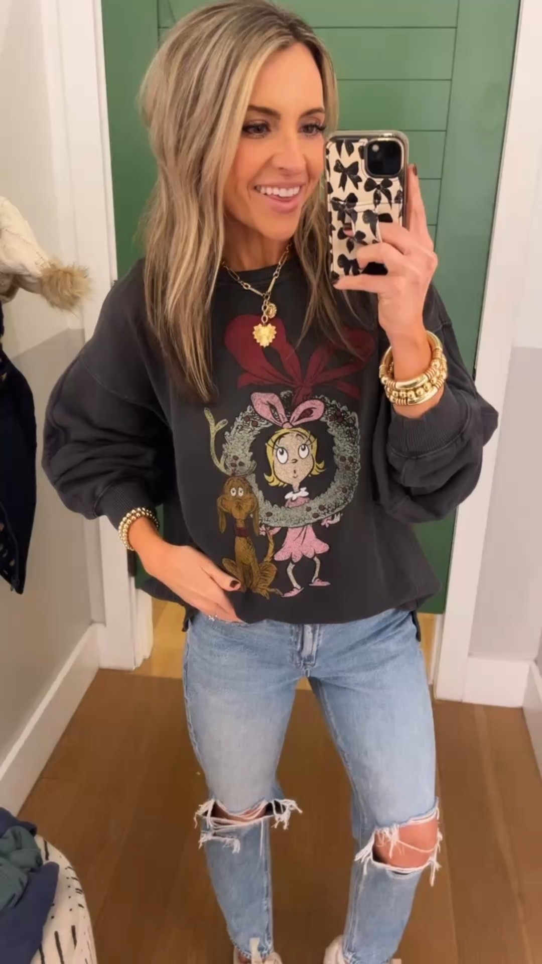How adorable is this holiday graphic sweatshirt!! Ah I love the big bow too 🎀 it’s on such an incredible sale right now!!!!! When I saw the price I grabbed it so fast! I’m wearing xs here, but bought xxs. It’s an oversized fit! Size down. Leggings friendly! 

#LTKSaleAlert #LTKSeasonal #LTKHoliday