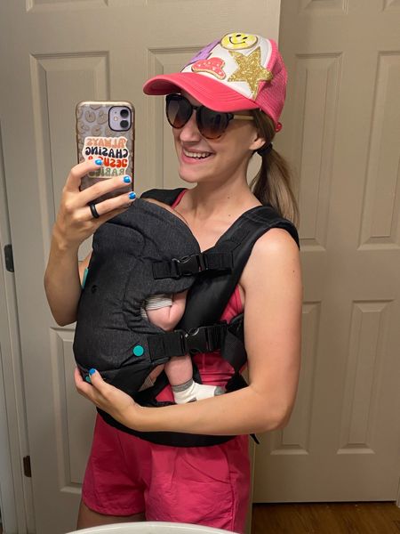 Must have baby item: a baby carrier!! Featuring my Amazon athletic romper and trucker hat!! 