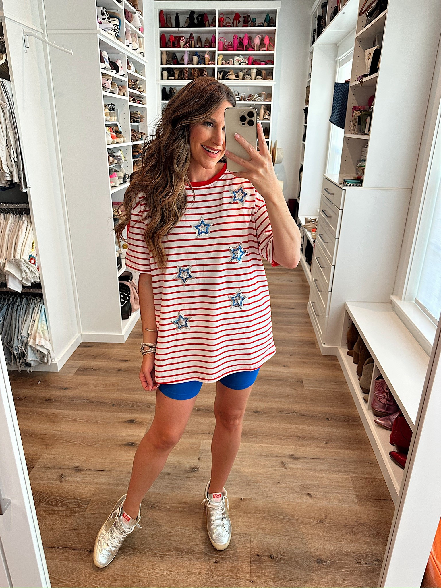 In a large sequin star stripe tee, small biker shorts, sneakers and accessories for patriotic look- fits tts.

#LTKStyleTip #LTKFindsUnder50 #LTKSeasonal