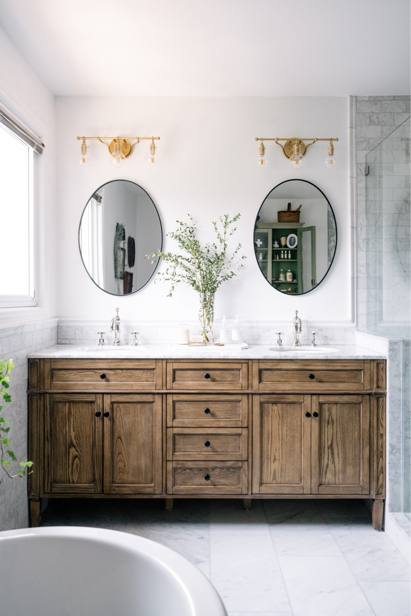 Our master bathroom makes me so happy. The mix of marble and warm wood is such a beautiful combo  

#LTKhome