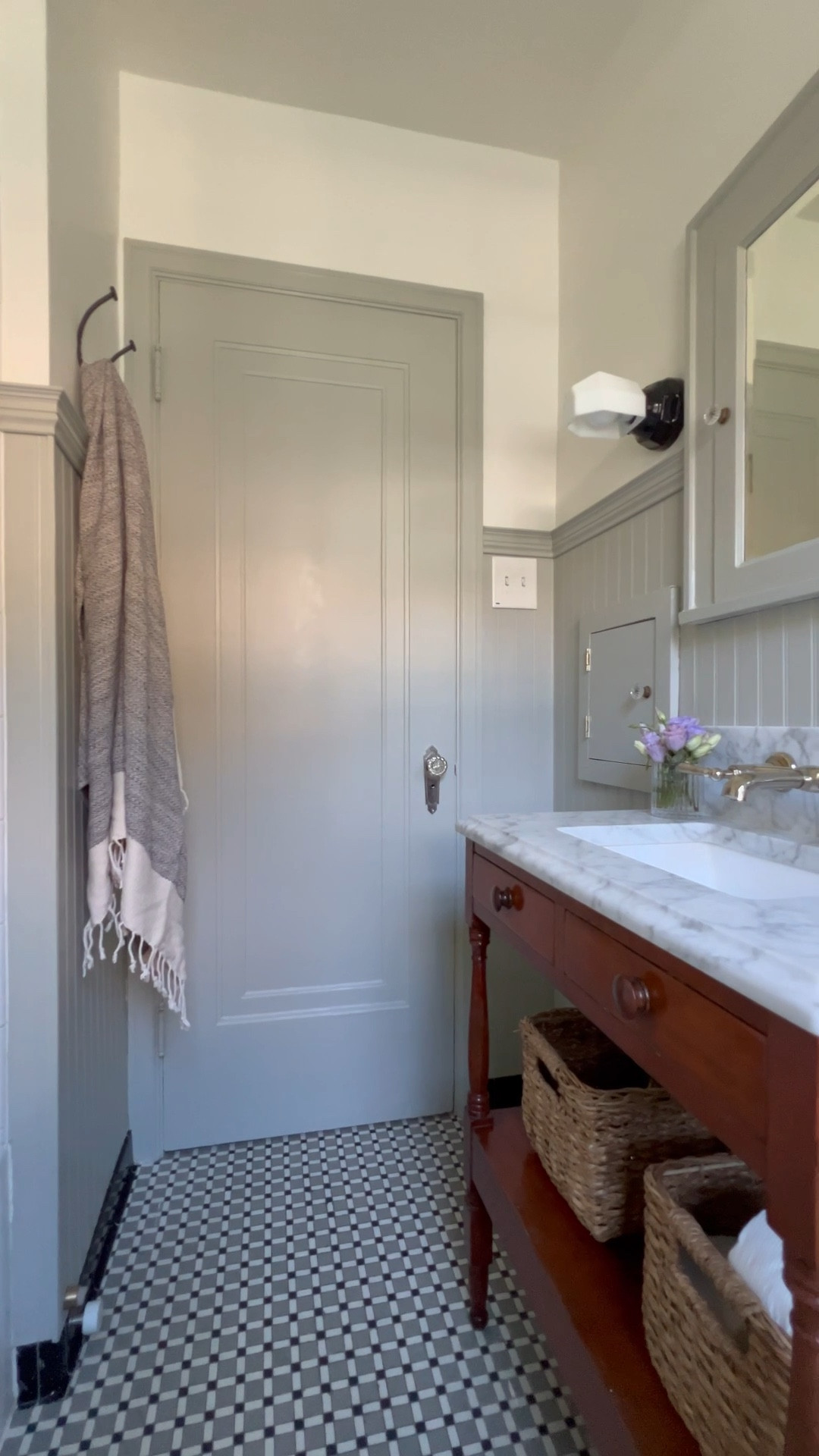 The bathroom window had its moment this spring, and now it’s the door’s time to shine! 
The chipped veneer needed patching with wood filler. Next came primer, then paint the same color as the wainscoting. For the smoothest finish without a sprayer, I used a foam roller and it worked great. Smooth like butter! 

I can’t believe how much more finished it feels in here. Little by little, this bathroom is coming together—1.5 years in the making.😬 #handmademodernhome 

#LTKHome #LTKVideo