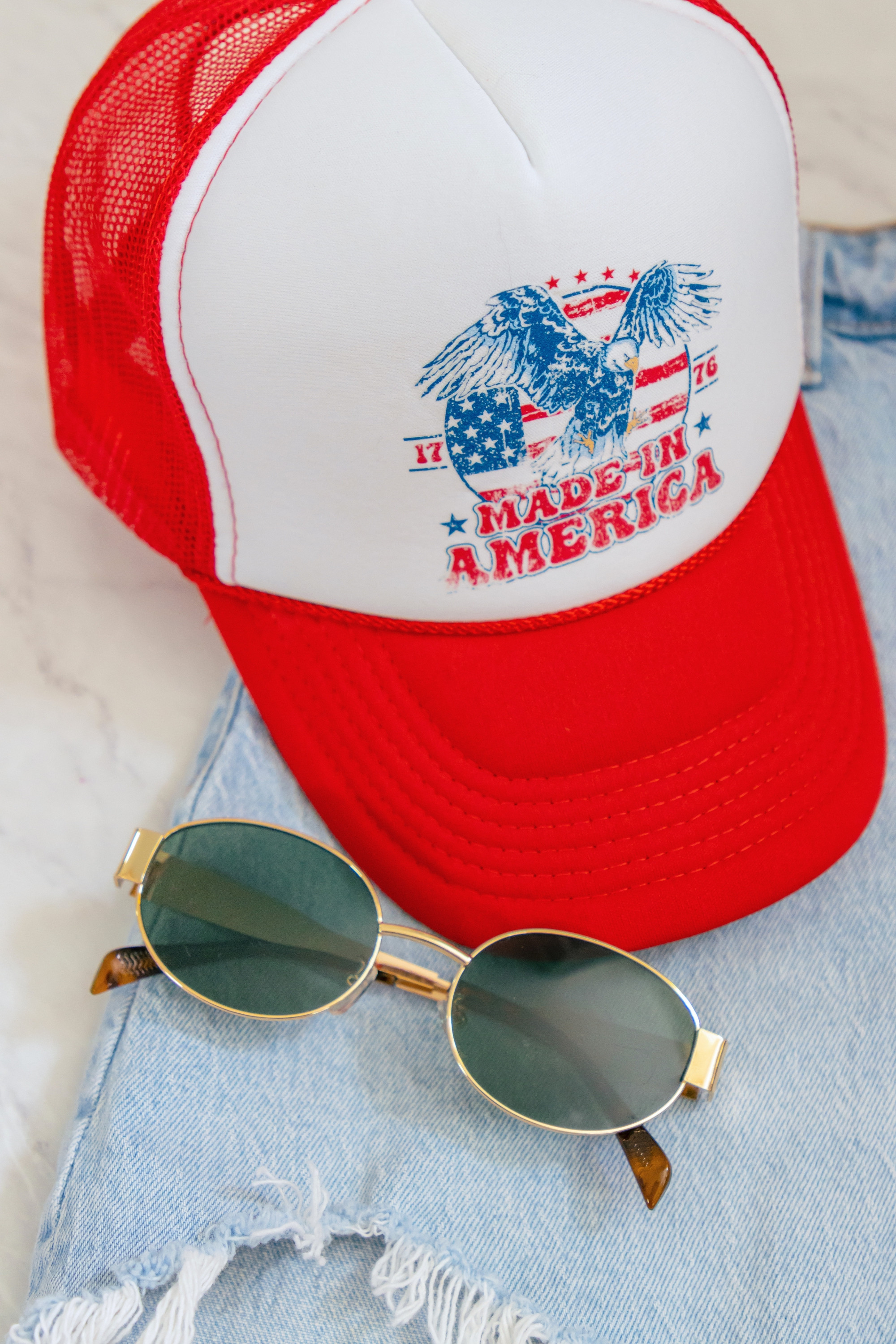 Adoring this fun trucker hat with my new pair of retro oval sunglasses! Perfect for a stylish and patriotic look. I've worn them for a boat day or two!! These shorts also add a trendy touch to my outfit.
 

 #LTKootd #LTKSeasonal #LTKOver40