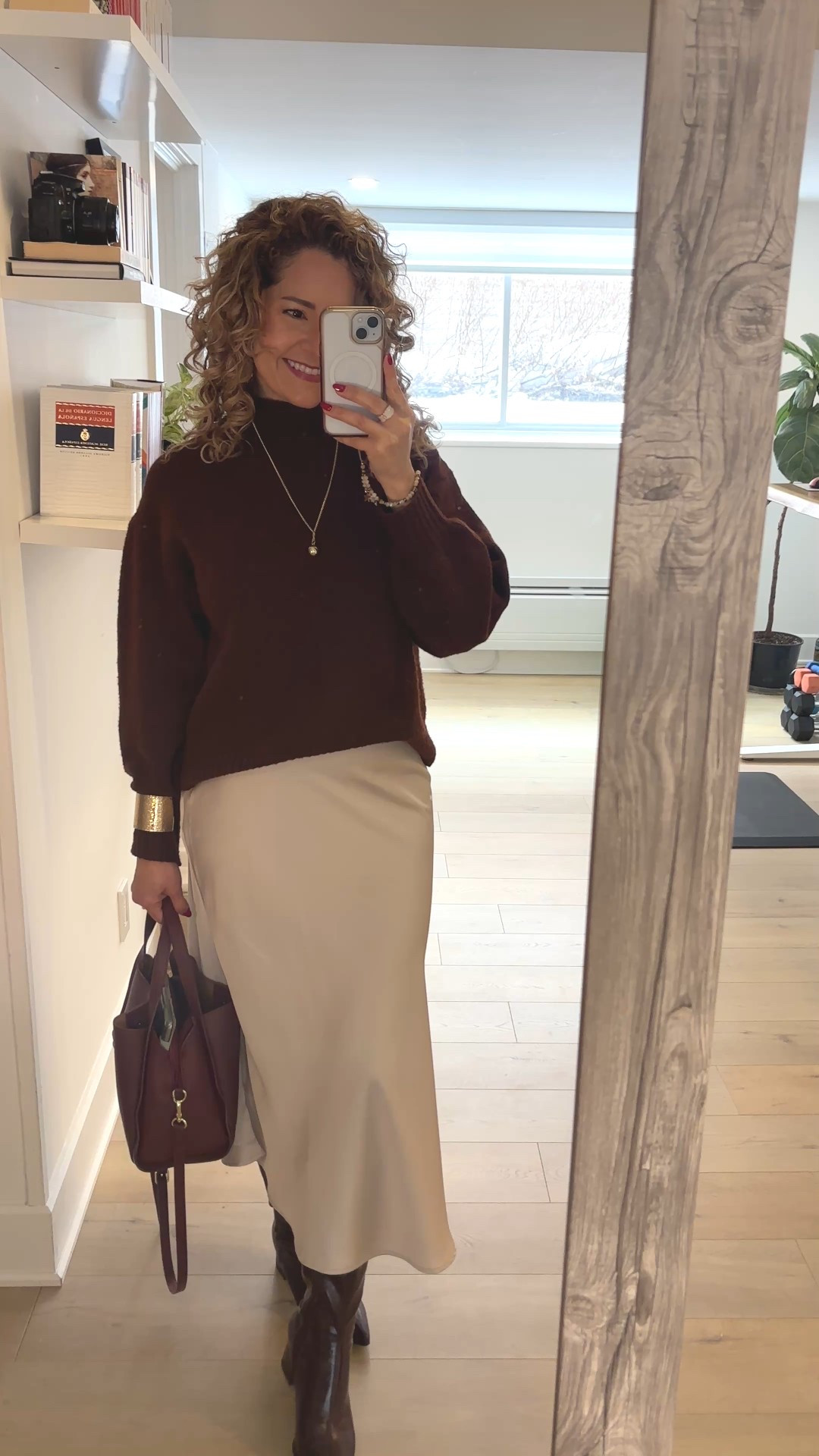 Effortless elegant fall outfit featuring a cozy brown sweater styled with a champagne satin midi skirt and knee-high boots. A perfect neutral and feminine look for the office, meetings, date night, or a smart casual capsule wardrobe. Timeless, classy, and easy to recreate.

#LTKstyletip #LTKcanada #LTKfall