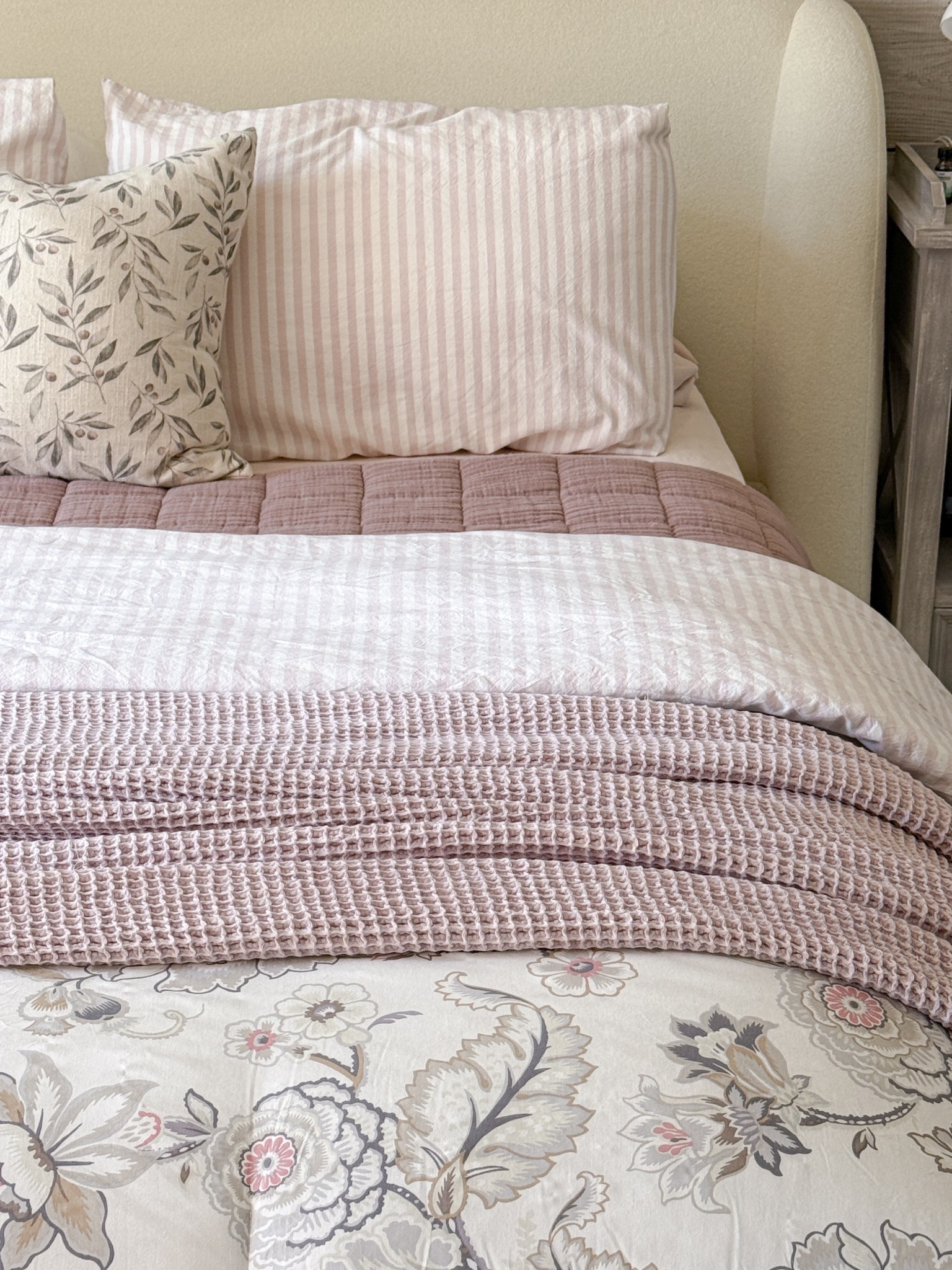 Pink and mauve layered bedding 