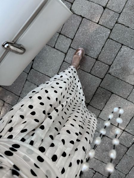 Polka dots are always chic. Wearing this Zimmerman dress in a 0. Could have taken 00 too.  Great for a European trip. 