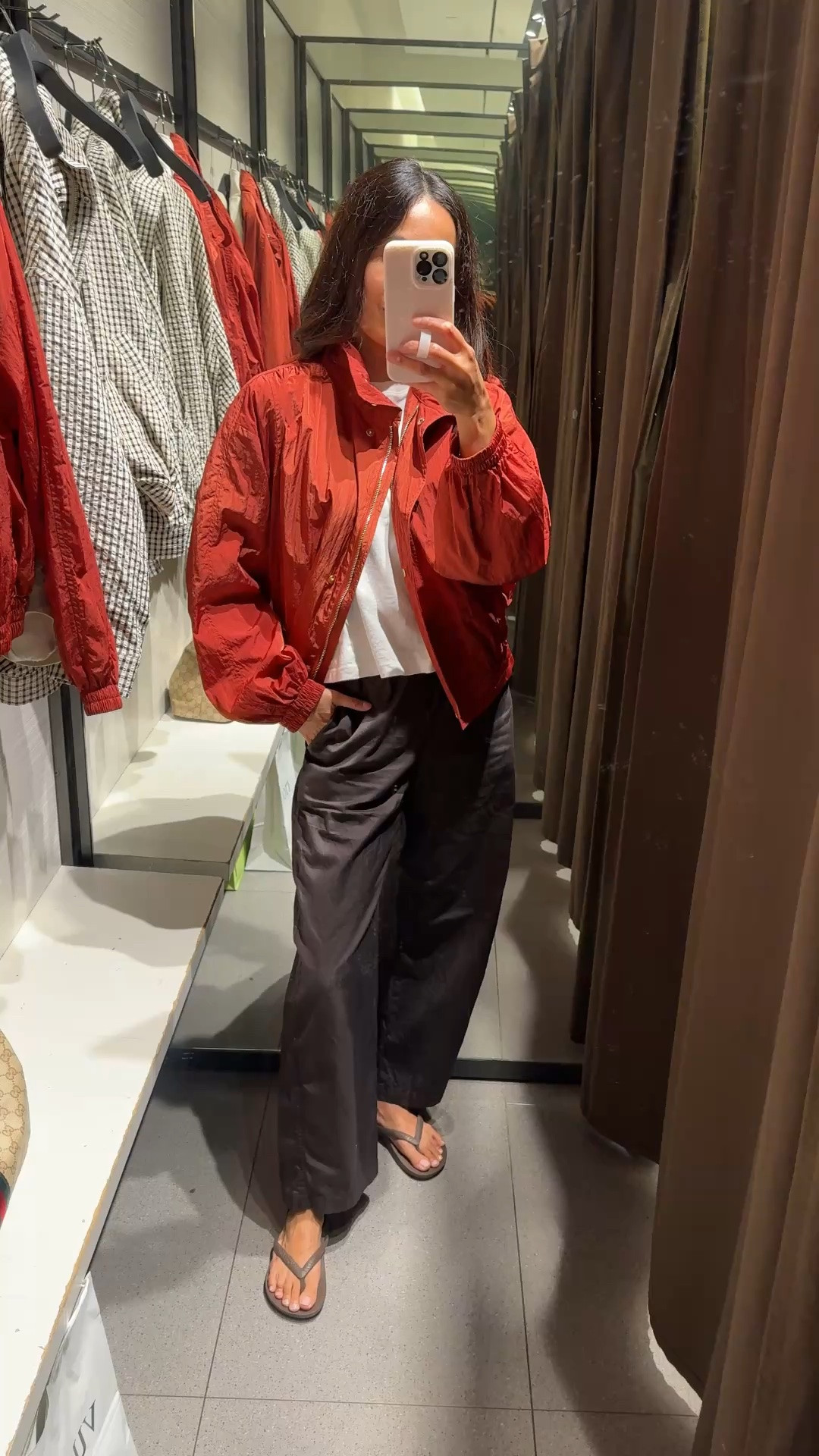 Fall transition outfit. Bomber jacket. 
I love this bomber jacket!  It’s like an elevated windbreaker style. The color is a beautiful warm red with chic details. Lightweight and water resistant. True to size.
Favorite cotton t-shirt. I take both true to size and a size up for different looks. 
Favorite poplin cotton pants that I wear lots. I size down. 
Flip flops with arch support. True to size.

#LTKOver40 #LTKootd