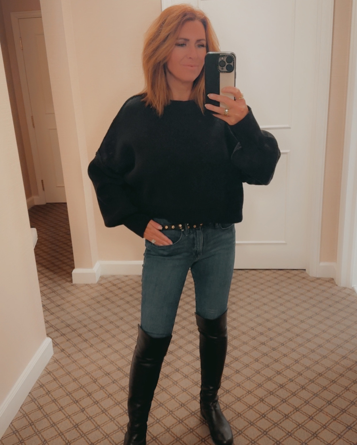 Winter fashion | black free people cropped sweater | black studded belt | good American jeans | black boots | Stuart Weitzman 

#LTKPetite #LTKootd #LTKSeasonal