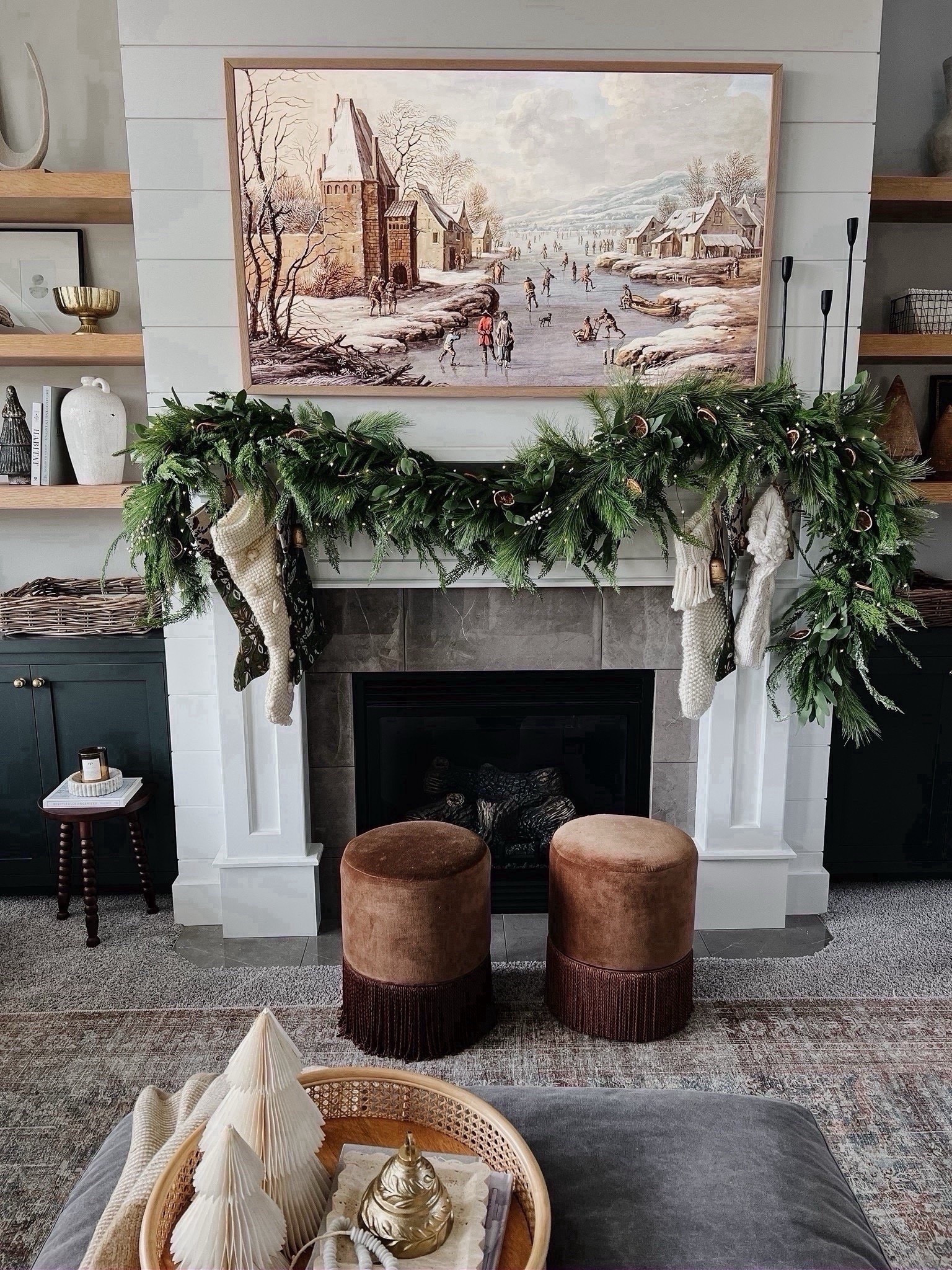 Our 2024 holiday mantle! I love the look of a full, organic, and woodland mantle for the holiday season! I achieve this look by layering in multiple strands of garland, and all of them being a different type! Pine, cedar, eucalyptus for a dimensional and whimsical look. 

#LTKHoliday #LTKHome #LTKSaleAlert