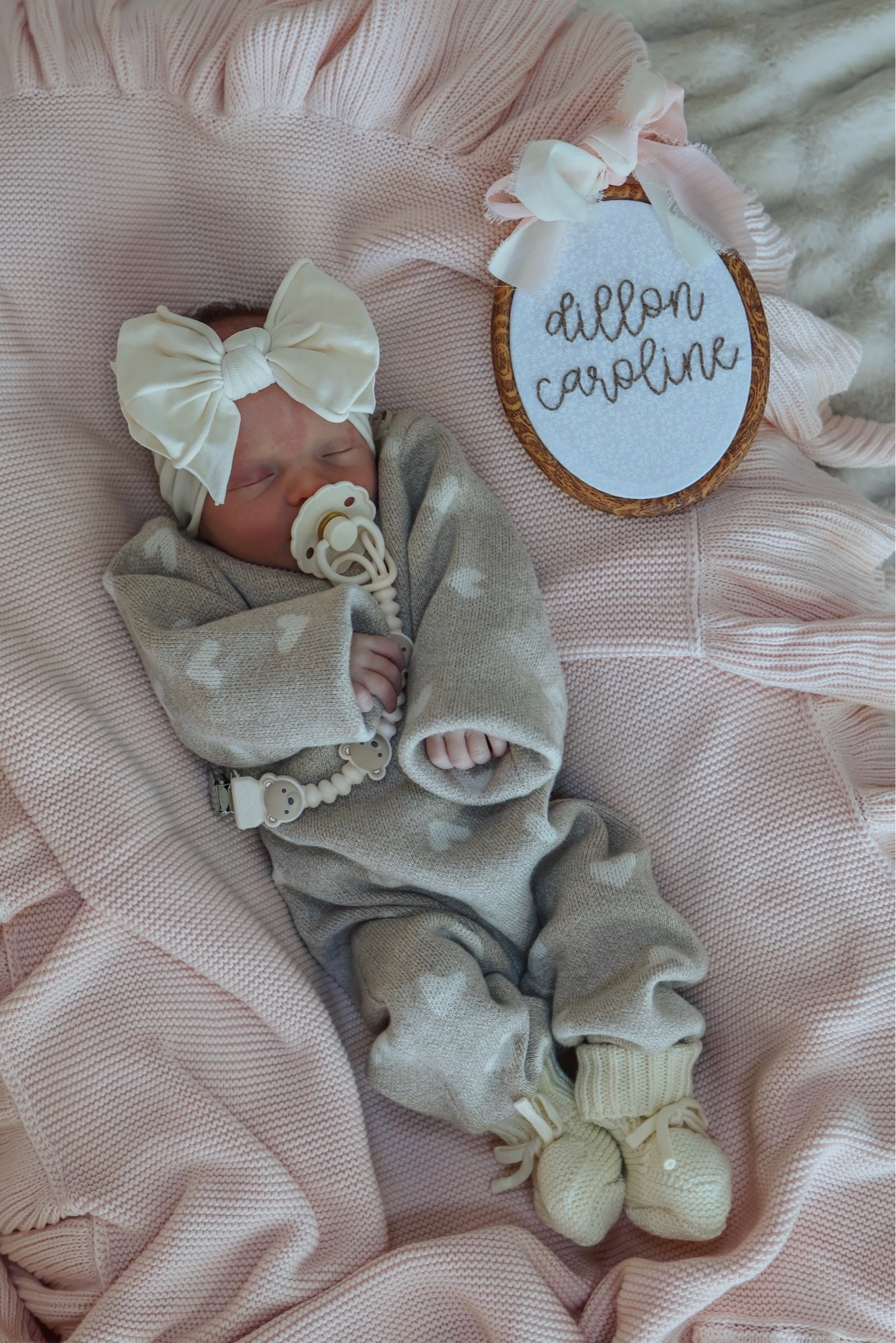 The heart sweater romper is from Milk and Baby (it’s called the Luna + Luca Heart Baby Jumpsuit!)