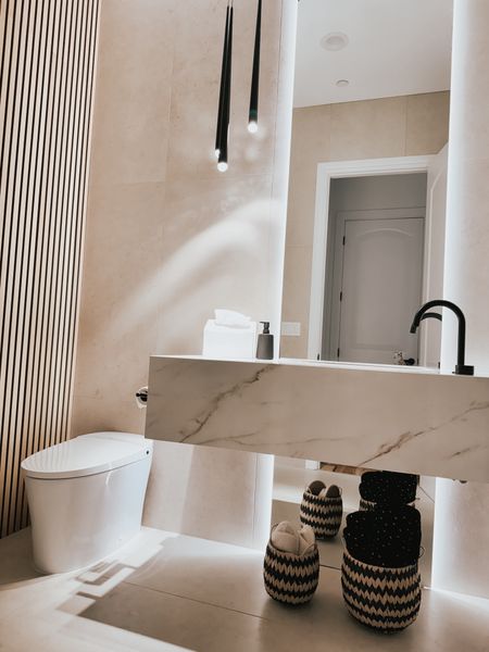 Guest bathroom decor and finds. Disposable hand towels and motion sensor trash can complete this fun and moody bathroom 

#LTKHome