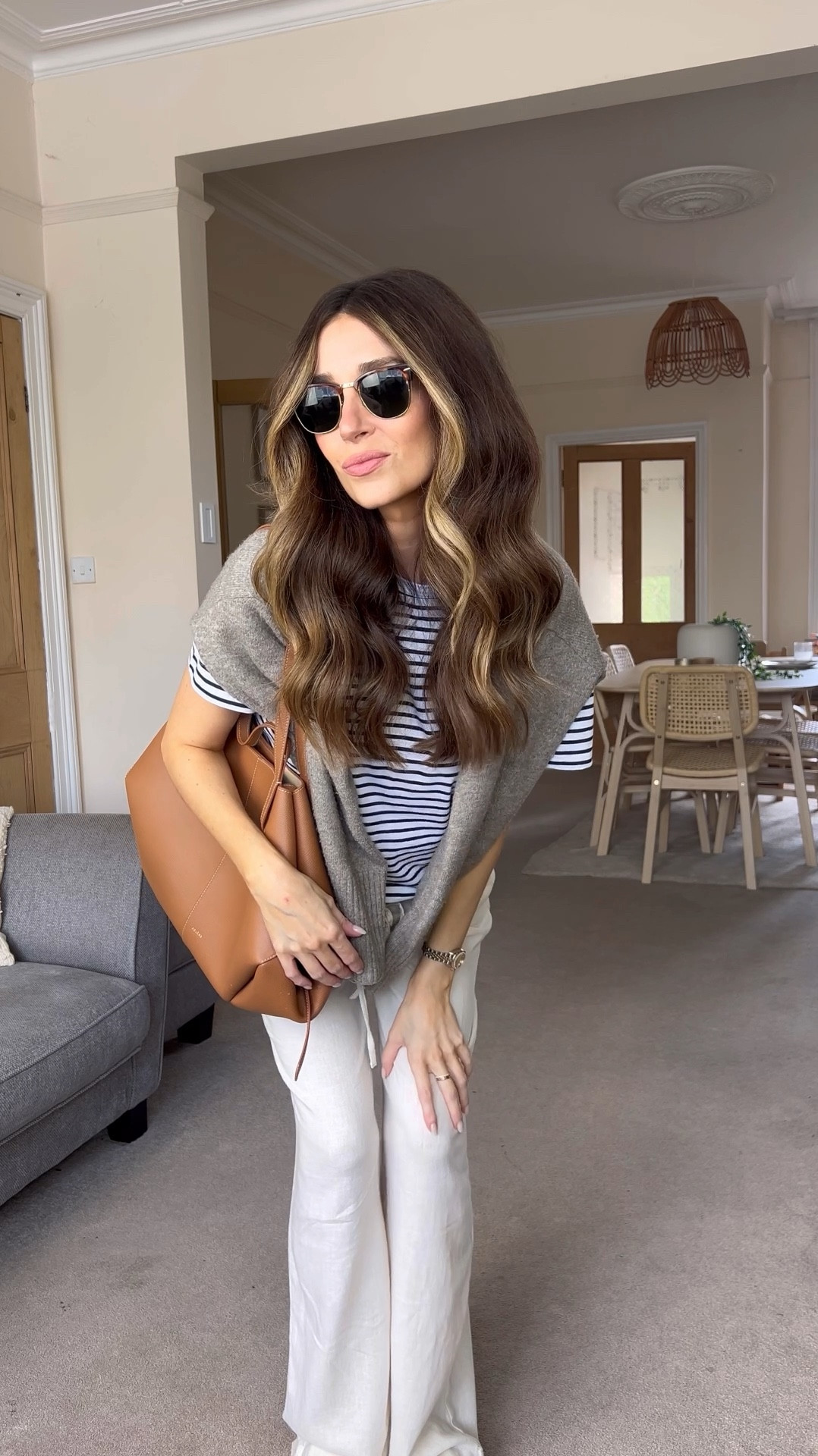 Transitional outfit that is bump friendly! I’m 27 weeks and still wearing my normal size of an 8 🤰🏻 Adidas trainers, stripe top, linen trousers, tan bag, rayban sunglasses 🍂 

#LTKautumn #LTKuk #LTKmaternity