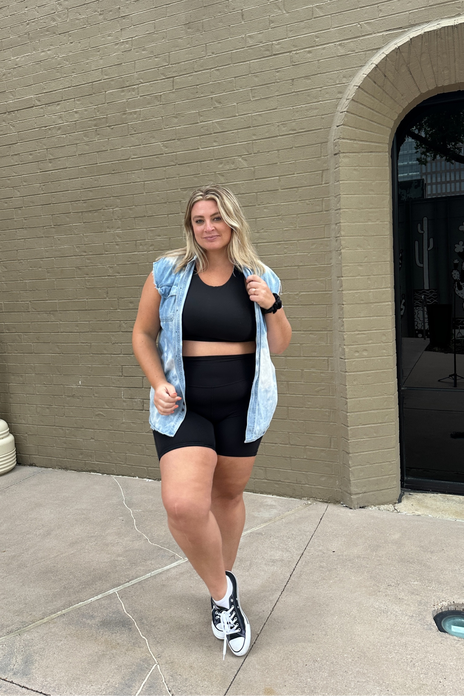 How to style black bike shorts — long line athleta sports bra, thrifted denim vest, converse, biker shorts #outfitidea #bikershorts #bikeshorts #size14 

#LTKunder100 #LTKstyletip #LTKcurves