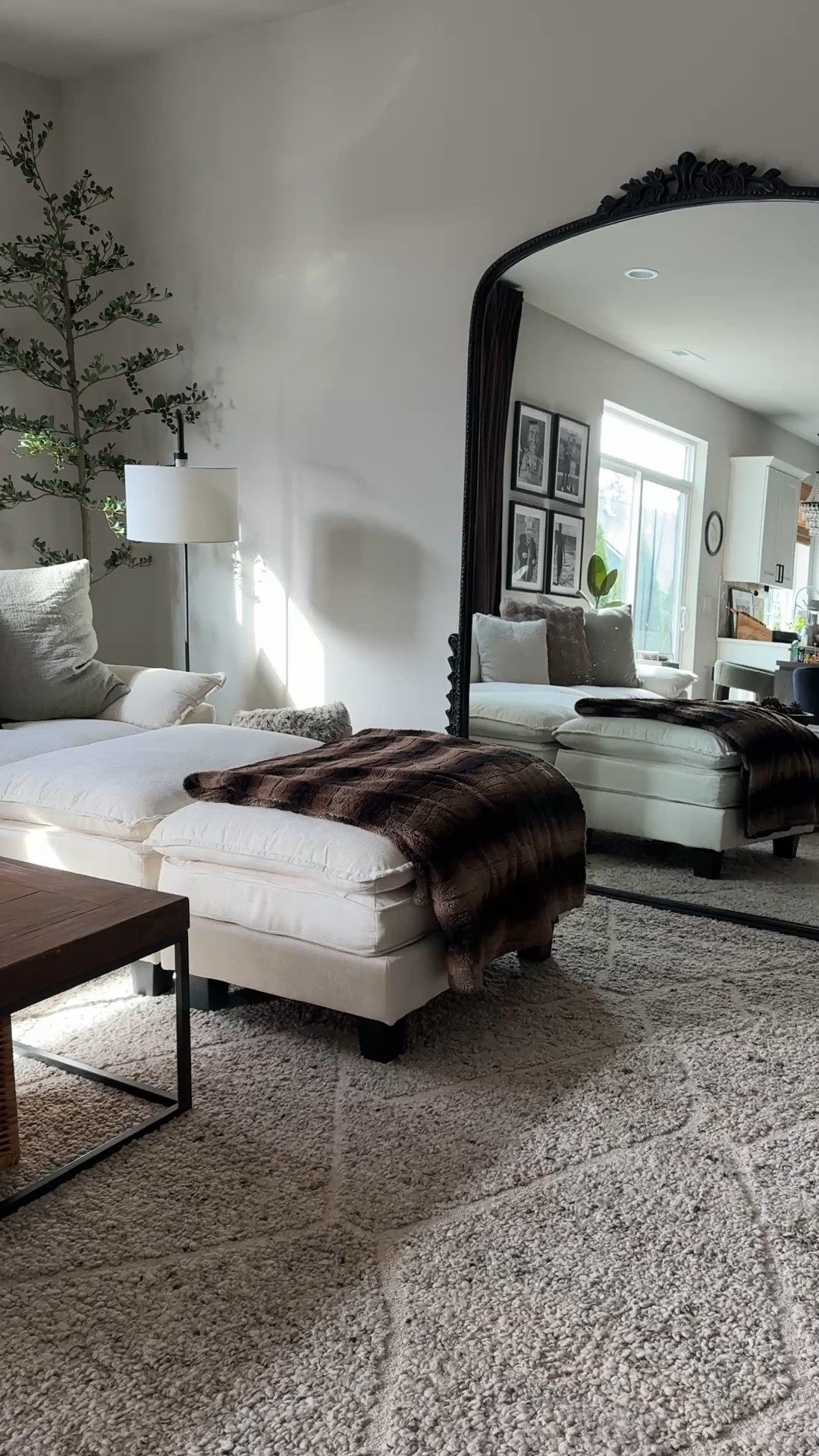 Living Room details: mirror, rug, couch, table, curtains, olive tree. 

#LTKHome #LTKSpringSale