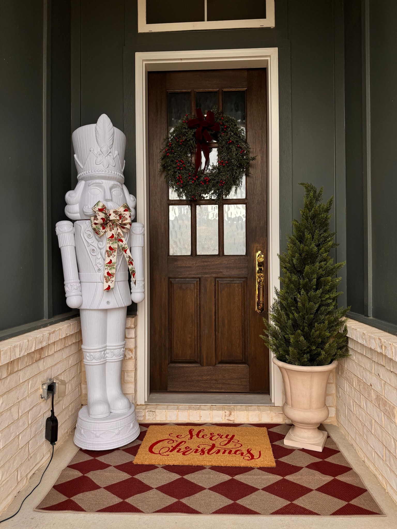 Christmas porch decor, holiday front porch, outdoor Christmas decorations, nutcracker decor, nutcracker statue, porch nutcracker, Christmas entryway ideas, holiday home decor, front porch styling, outdoor holiday mat, red doormat, Christmas doormat, winter porch decor, cedar trees outdoor, faux cedar tree, porch greenery, front door Christmas ideas, Christmas home inspiration, cozy porch Christmas, Christmas outdoor styling, holiday porch setup, farmhouse Christmas porch, traditional Christmas decor, classic Christmas porch, festive entryway, outdoor holiday greenery, front stoop decor, holiday curb appeal, porch rug Christmas, outdoor rug red, Christmas aesthetic, neutral Christmas porch, modern traditional Christmas

#LTKHome #LTKSeasonal #LTKHoliday