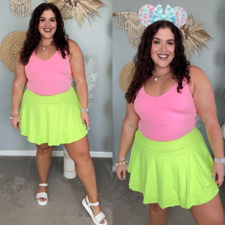 Disney themed amusement park outfits 🏰🐭🎆 Workout tank top + skort. Spring/Summer colorful outfits, curvy approved. 
Tank top: XXL
Skort: XL
Mickey ears custom from a small business on Etsy. Exact styles are sold out, linking similar options from seller
#disneyoutfits 

#LTKSeasonal #LTKActive #LTKstyletip